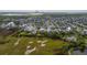 Aerial view of a residential community showcasing well-maintained homes and green spaces with waterfront views at 2522 Waverly St, Charleston, SC 29492