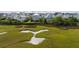 Stunning aerial view of a waterway, houses, and lush marshland, showcasing the property's natural surroundings at 2522 Waverly St, Charleston, SC 29492