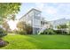 Expansive backyard with lush green lawn and mature trees, offering privacy and serenity at 2522 Waverly St, Charleston, SC 29492