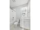 Bathroom with a shower-tub combo, toilet, and vanity with a mirror at 2522 Waverly St, Charleston, SC 29492