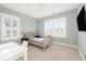 Bedroom featuring a comfy bed, desk, and windows with plantation shutters at 2522 Waverly St, Charleston, SC 29492