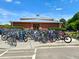 Bike rack filled with colorful bicycles at a community center under sunny skies at 2522 Waverly St, Charleston, SC 29492