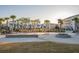 Beautiful community fountain with palm trees and well-manicured landscaping at 2522 Waverly St, Charleston, SC 29492