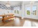 Dining room with wood floors, table and chairs, and french doors to outdoor living space at 2522 Waverly St, Charleston, SC 29492