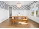 Dining room with hardwood floors, wood table and chairs, and stylish wall decor at 2522 Waverly St, Charleston, SC 29492