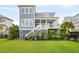 Beautiful two-story home with classic architecture, large windows, and inviting outdoor spaces at 2522 Waverly St, Charleston, SC 29492
