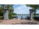 Charming lake view with paver steps leading to the water, framed by stone pillars at 2522 Waverly St, Charleston, SC 29492