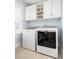 Modern laundry room featuring white cabinets, a window and new washer and dryer at 2522 Waverly St, Charleston, SC 29492