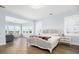 Serene main bedroom with natural light, hardwood floors, and a separate sitting area with scenic views at 2522 Waverly St, Charleston, SC 29492