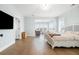 Serene main bedroom with natural light, hardwood floors, and a separate sitting area with scenic views at 2522 Waverly St, Charleston, SC 29492