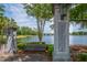 Smythe Park entrance features lantern posts, a park bench, and a tranquil lake view at 2522 Waverly St, Charleston, SC 29492