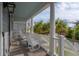 Covered front porch featuring rocking chairs, and white columns at 2522 Waverly St, Charleston, SC 29492