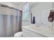 Clean bathroom featuring a white vanity and a neutral tone shower curtain at 2557 Hatch Dr, Johns Island, SC 29455