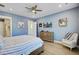 Serene bedroom with comfortable bed, natural light, and hardwood floors at 2557 Hatch Dr, Johns Island, SC 29455