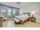 Bright bedroom with large bed, decorative wallpaper, and natural light at 2557 Hatch Dr, Johns Island, SC 29455