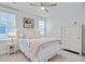 Comfortable bedroom featuring a well-made bed and a stylish side table with lamp at 2557 Hatch Dr, Johns Island, SC 29455