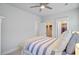 Bright bedroom featuring a striped comforter and two doorways with closet space at 2557 Hatch Dr, Johns Island, SC 29455
