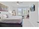 Bedroom features a ceiling fan, a window, and artwork on the walls at 2557 Hatch Dr, Johns Island, SC 29455