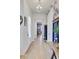 Bright entryway featuring beautiful hardwood floors, stylish wallpaper, and a charming wooden table at 2557 Hatch Dr, Johns Island, SC 29455