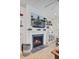 Fireplace with white mantel and TV above in a cozy living room setting at 2557 Hatch Dr, Johns Island, SC 29455