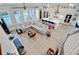 Open-concept living room and kitchen area with hardwood floors and plenty of natural light at 2557 Hatch Dr, Johns Island, SC 29455