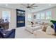 Living room with fireplace, large TV, comfortable seating and lots of natural light at 2557 Hatch Dr, Johns Island, SC 29455