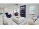 Living room with fireplace, large TV, comfortable seating and lots of natural light at 2557 Hatch Dr, Johns Island, SC 29455