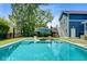 Backyard oasis featuring a sparkling pool, stylish sun loungers, and a tranquil setting, perfect for unwinding at 2557 Hatch Dr, Johns Island, SC 29455