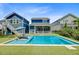 Backyard with a refreshing pool, lounge chairs, and lush green turf, ideal for relaxation and entertaining at 2557 Hatch Dr, Johns Island, SC 29455