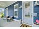 Inviting porch with rocking chairs and cozy decor, perfect for enjoying the outdoors at 2557 Hatch Dr, Johns Island, SC 29455