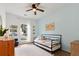 Cozy bedroom with blue accent wall, natural light, and a comfortable daybed at 2560 Palmetto Hall Blvd, Mount Pleasant, SC 29466