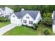 Bright, inviting two-story home featuring a well-manicured lawn and attached garage, set in a wooded neighborhood at 2560 Palmetto Hall Blvd, Mount Pleasant, SC 29466
