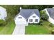 Inviting two-story home featuring a well-manicured lawn and attached garage in a serene, wooded neighborhood setting at 2560 Palmetto Hall Blvd, Mount Pleasant, SC 29466