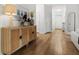 Elegant foyer boasting wood floors, a decorative cabinet, and a welcoming entrance to the home at 2560 Palmetto Hall Blvd, Mount Pleasant, SC 29466
