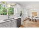 Bright kitchen with stainless appliances, white cabinets, and an adjacent dining area at 2560 Palmetto Hall Blvd, Mount Pleasant, SC 29466