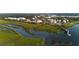 Stunning aerial view of waterfront community, showcasing lush landscaping, waterways, and beautiful architecture at 2578 Helmsman Rd, Johns Island, SC 29455