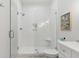 Bright bathroom with a glass shower, subway tile, a white vanity, and brushed silver accents at 2578 Helmsman Rd, Johns Island, SC 29455