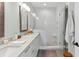 Bright bathroom with white subway tile shower, double vanity, and neutral decor at 2578 Helmsman Rd, Johns Island, SC 29455