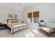 Light-filled bedroom featuring neutral decor and a cozy sitting area at 2578 Helmsman Rd, Johns Island, SC 29455