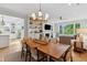 Open-concept dining room with a chandelier and views into the living room and kitchen at 2578 Helmsman Rd, Johns Island, SC 29455