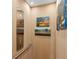 Elevator interior with wood paneling, a metal control panel, a handrail, and peaceful nature art at 2578 Helmsman Rd, Johns Island, SC 29455