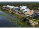 Scenic view of waterfront residences with kayak access and lush greenery, perfect for outdoor enthusiasts at 2578 Helmsman Rd, Johns Island, SC 29455