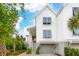 Charming two-story home with white siding, garage, louvers, and lush landscaping at 2578 Helmsman Rd, Johns Island, SC 29455
