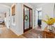 Entryway featuring hardwood floors, console table with decor, and view of the doorway at 2578 Helmsman Rd, Johns Island, SC 29455