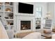 Bright living room with fireplace with built-in shelving and seating and decor at 2578 Helmsman Rd, Johns Island, SC 29455