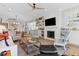 Spacious living room with fireplace, open shelving, dining area, and comfortable seating at 2578 Helmsman Rd, Johns Island, SC 29455