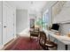 Bright office space features hardwood floors, natural light, and a comfortable rocking chair at 2578 Helmsman Rd, Johns Island, SC 29455