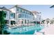 Resort-style pool area with luxurious lounge chairs and meticulously landscaped grounds at 2578 Helmsman Rd, Johns Island, SC 29455