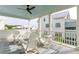 Inviting covered porch with comfortable seating and views of the neighborhood at 2578 Helmsman Rd, Johns Island, SC 29455