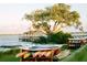Picturesque waterfront view showcasing paddleboards, a pier, and the natural beauty of the surrounding landscape at 2578 Helmsman Rd, Johns Island, SC 29455